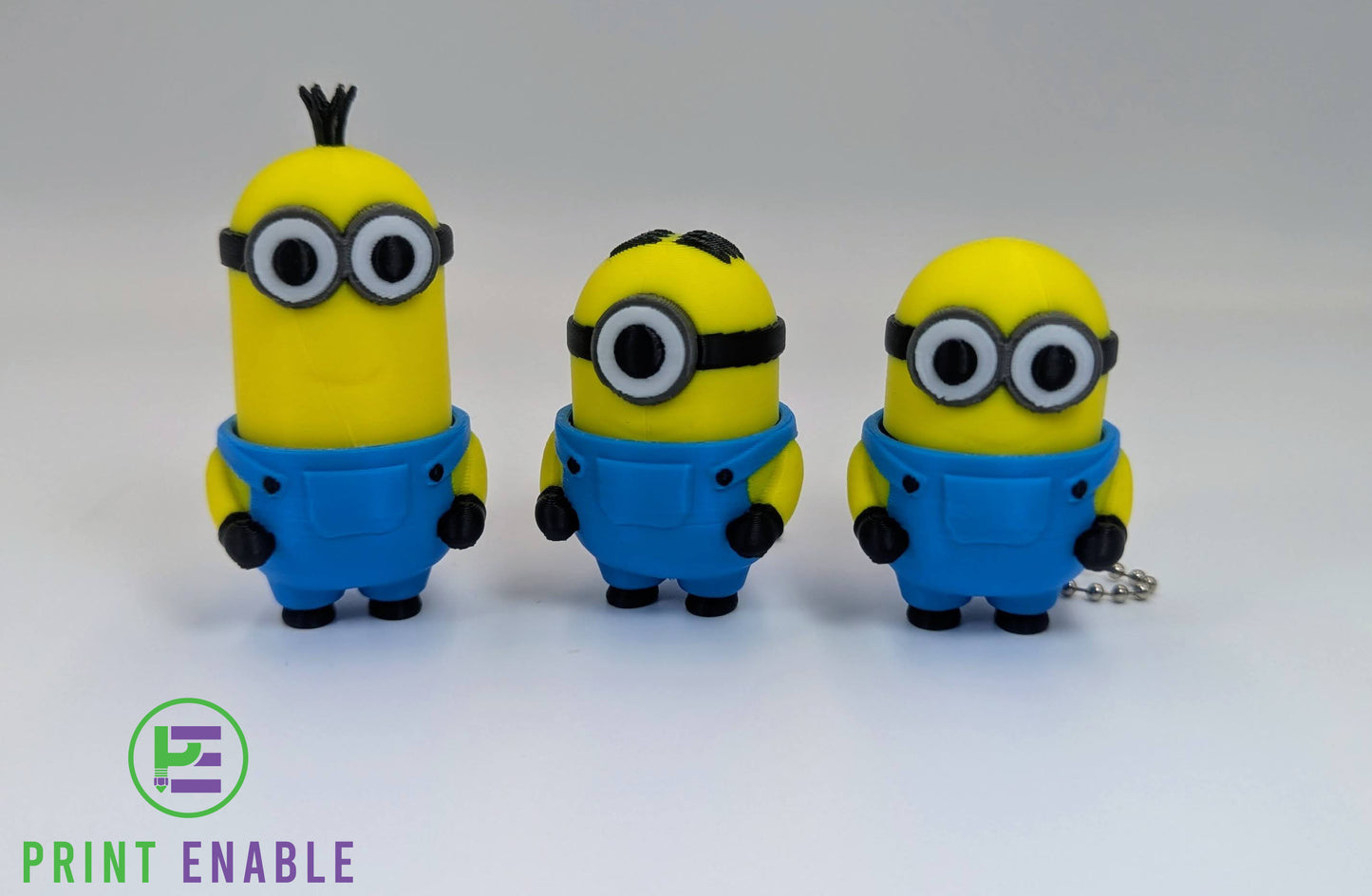 Randomly selected Minions 3D printed fidget clicker keychain featuring a compact character design with a satisfying mechanical click action.