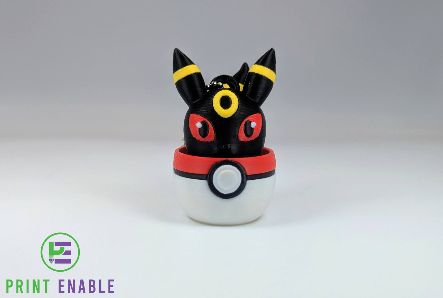 Umbreon 3D printed character fidget clicker keychain emerging from a ball with a satisfying mechanical click action.