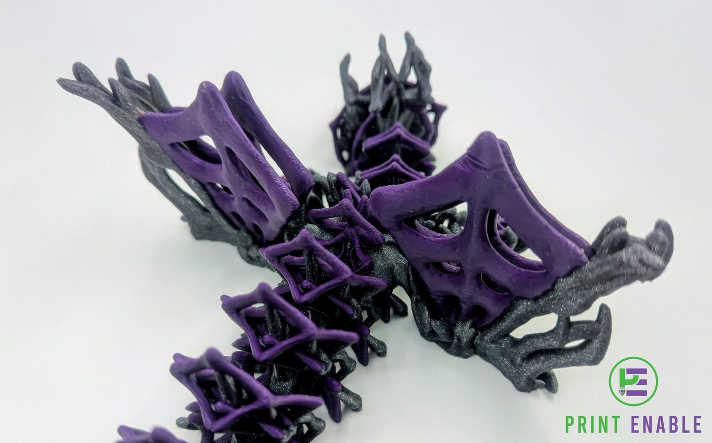 Detailed wing section of a purple and silver Wickedwing Dragon showing intricate web-inspired structure.
