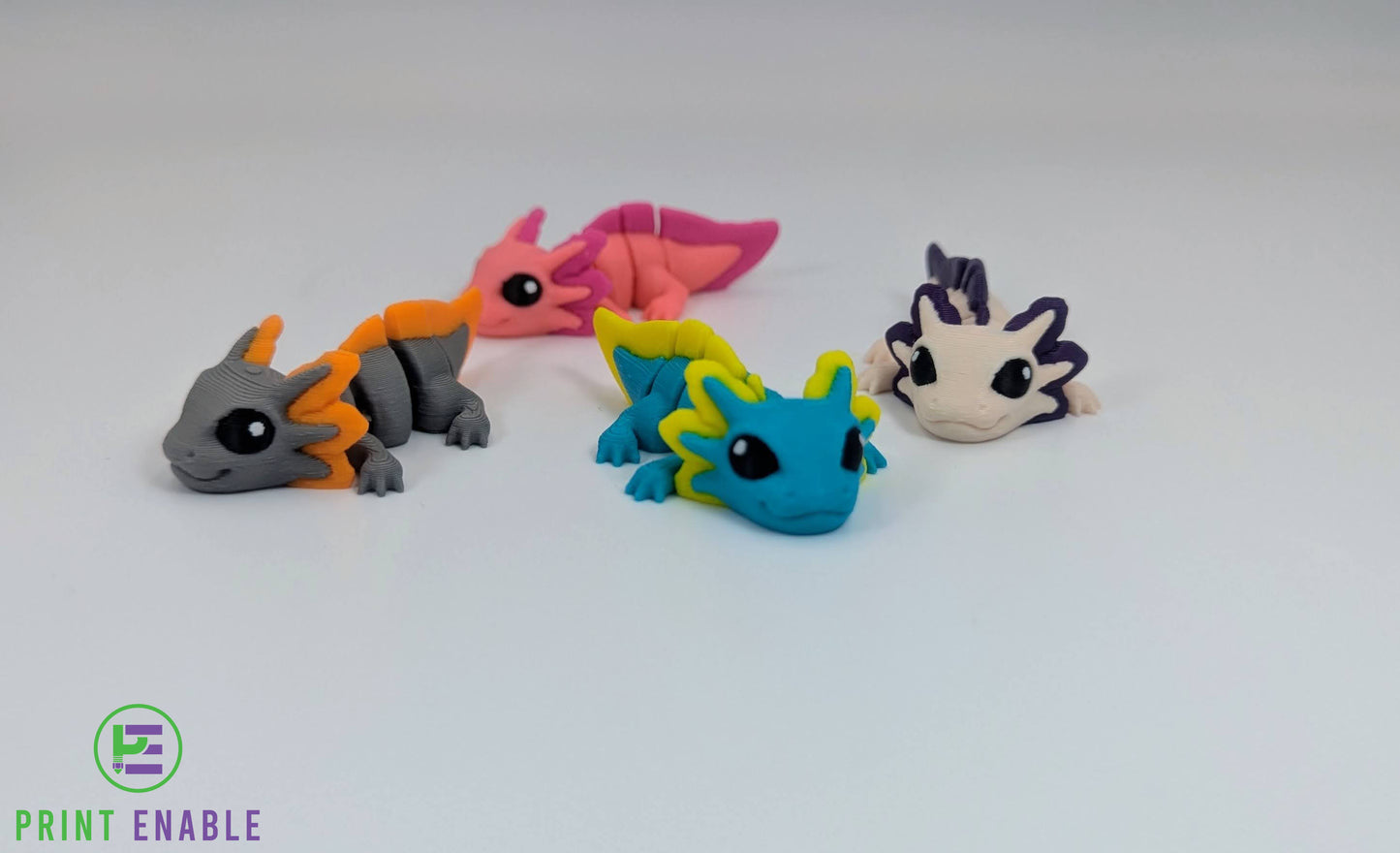 Axolotl Hatchling articulated 3D printed fidget shown in multiple colour variations