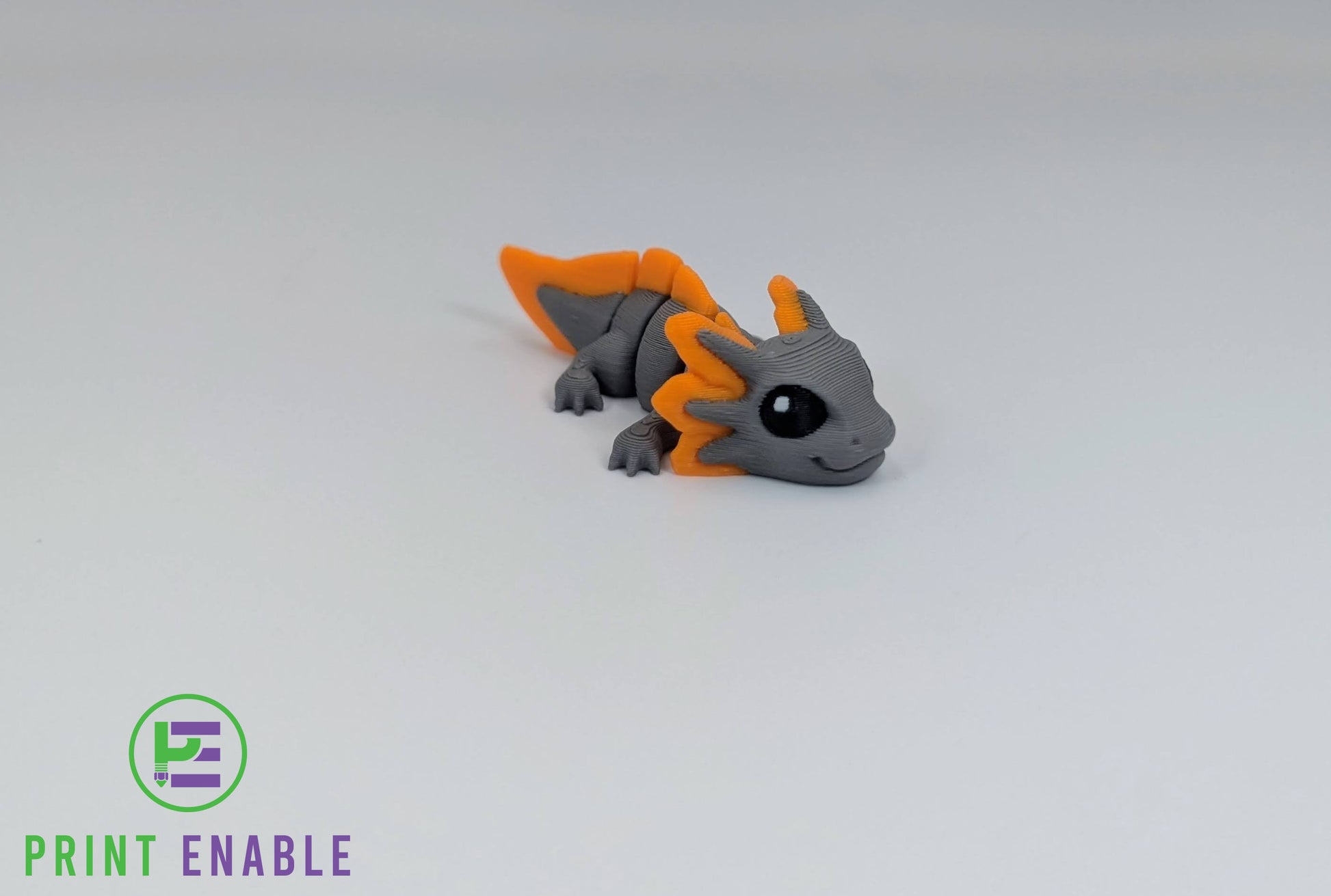 Grey and orange Axolotl Hatchling articulated 3D printed fidget front view showing external gills and smiling face