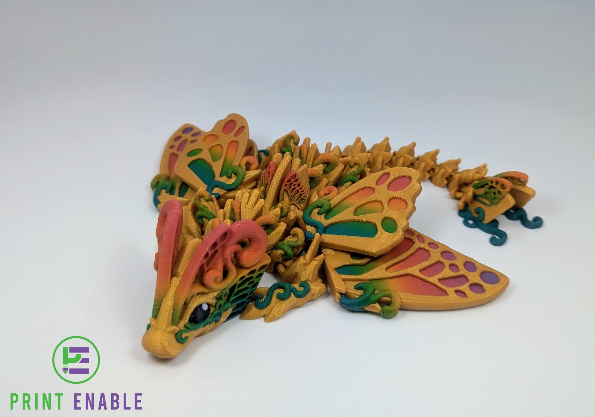 Side view of Baby Butterfly Dragon featuring articulated body, decorative wings, and flowing movement