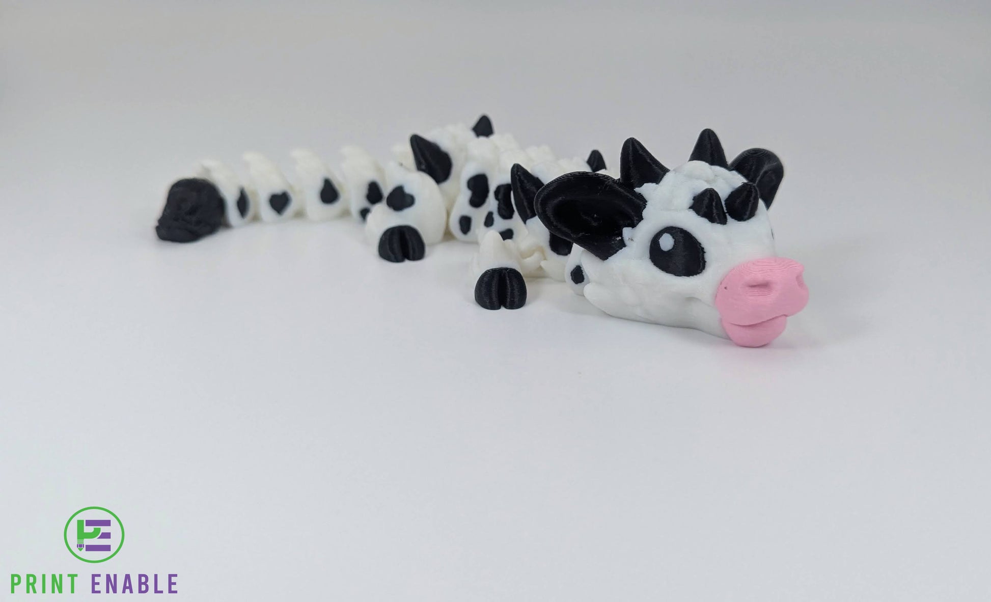 Articulated Baby Cow Dragon 3D printed dragon in black and white colour scheme