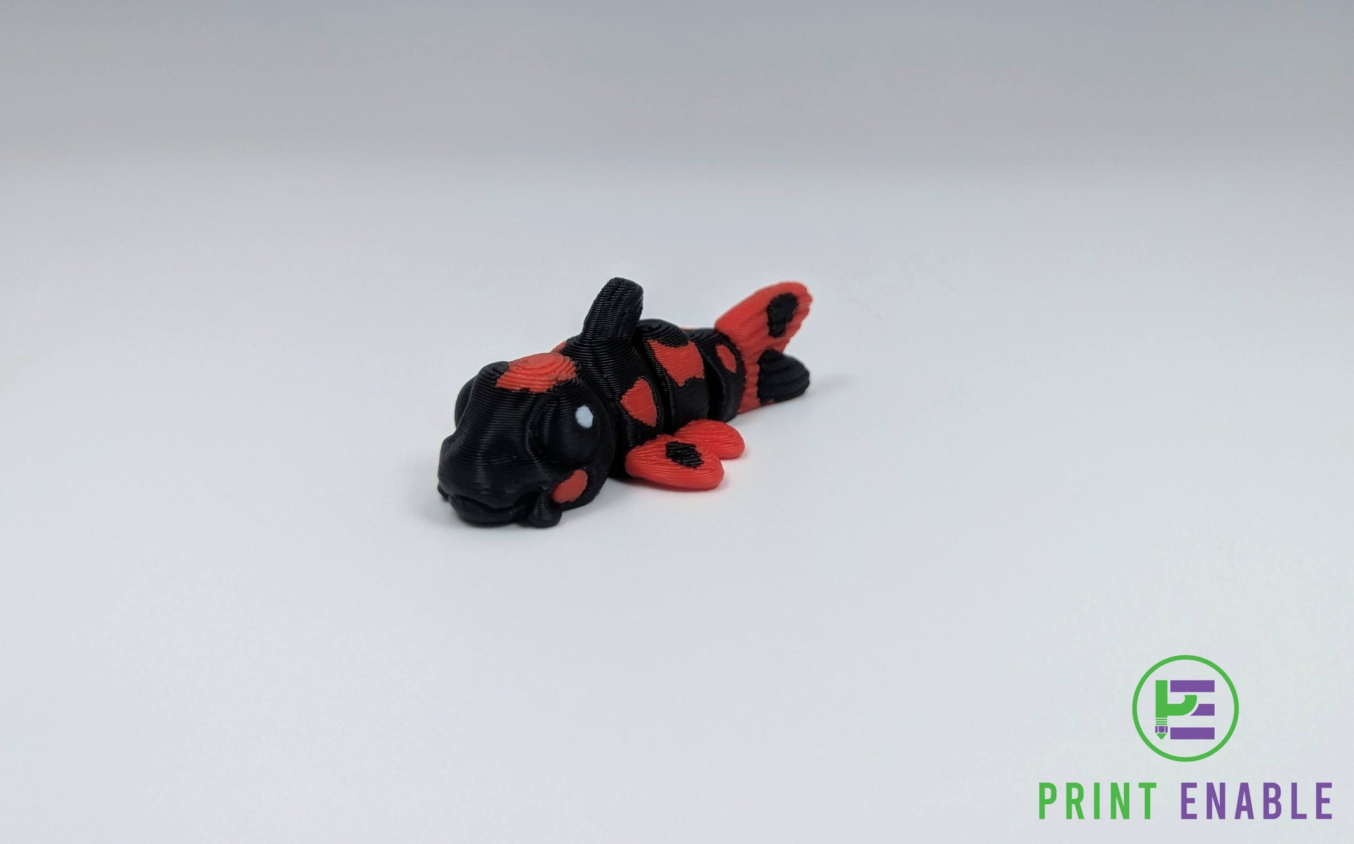 Articulated Koi Fish Hatchling and black Koi Fish Hatchling 3D printed fidgets