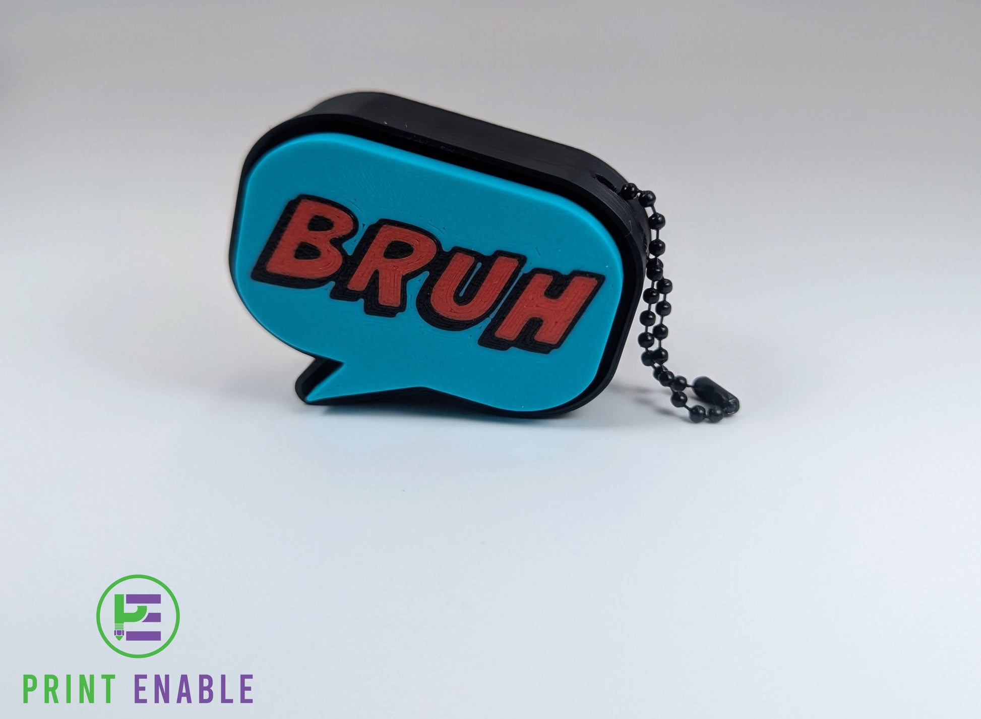 Blue Bruh clicker fidget keychain with bold text and tactile click button