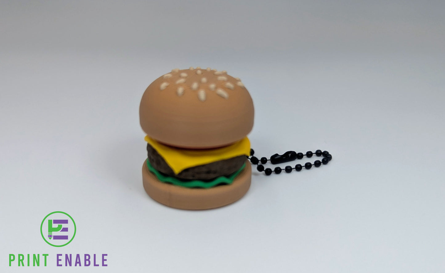 Burger Clicker keychain fidget featuring a miniature cheeseburger design.