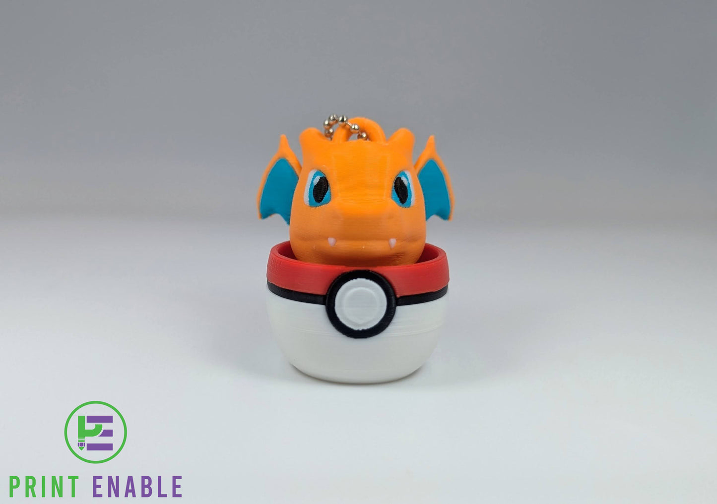 Charizard 3D printed character fidget clicker keychain emerging from a ball with a satisfying mechanical click action.