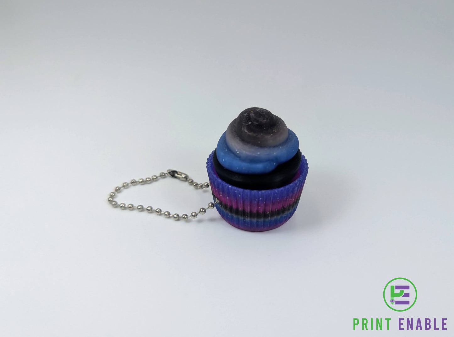 Cupcake clicker fidget with galaxy-style colours and textured frosting detail