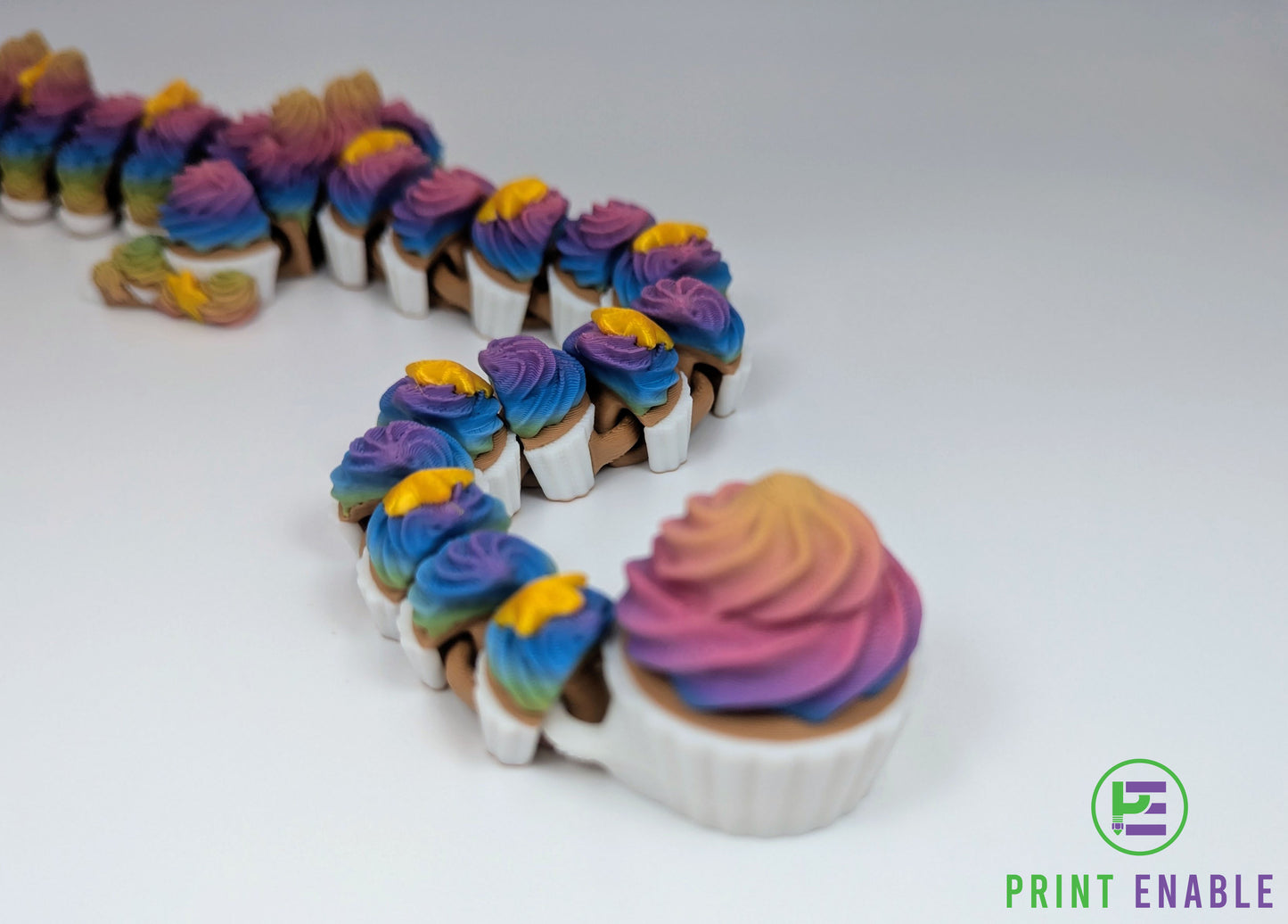 Cupcake Dragon tail section featuring cupcake scales, rainbow frosting textures and articulated segments.