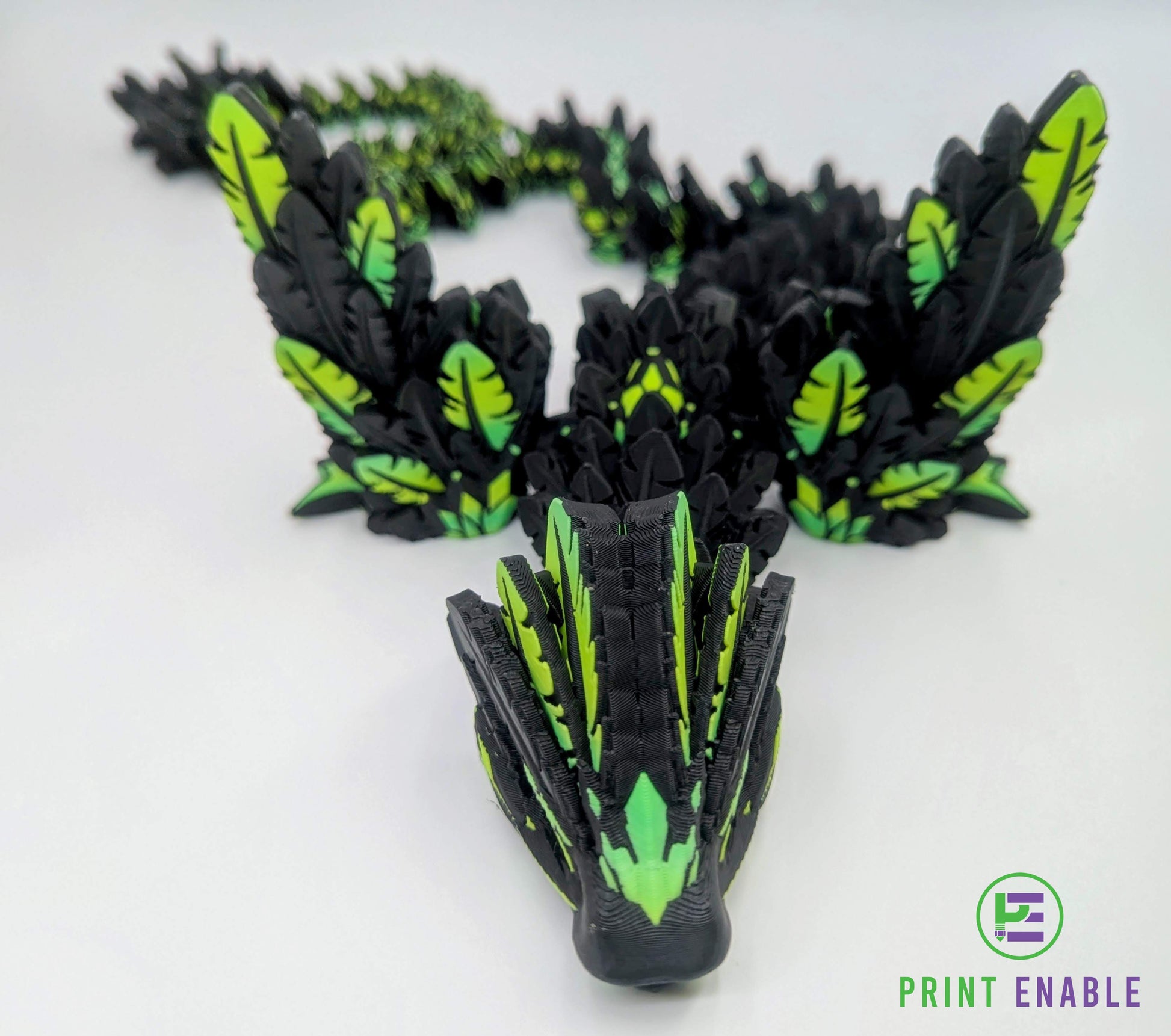 Black and green Flying Serpent articulated dragon posed in a curved display position