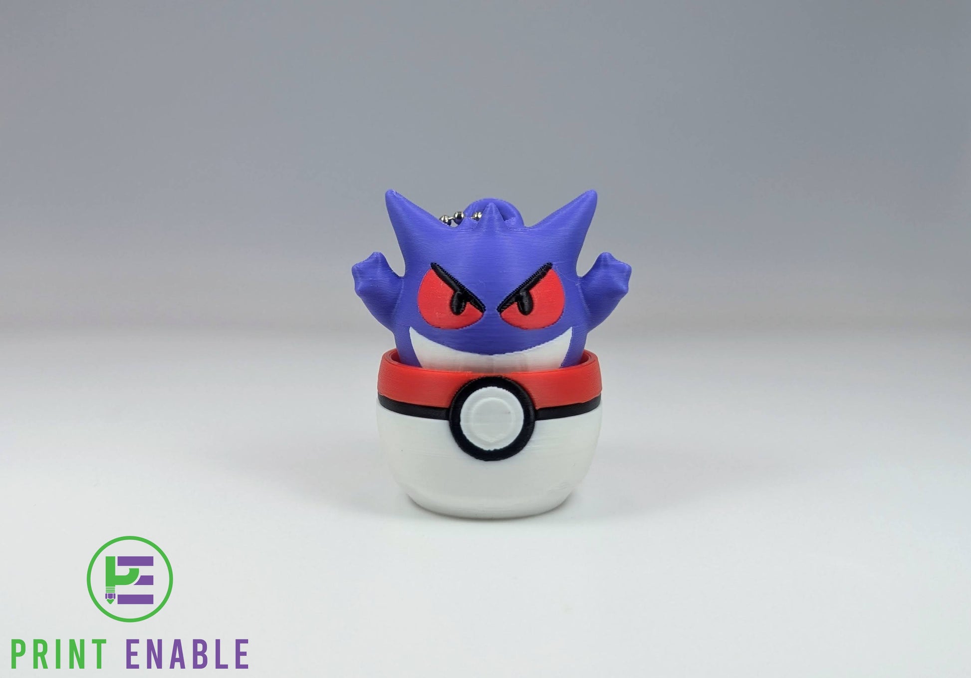 Gengar 3D printed character fidget clicker keychain emerging from a ball with a satisfying mechanical click action.