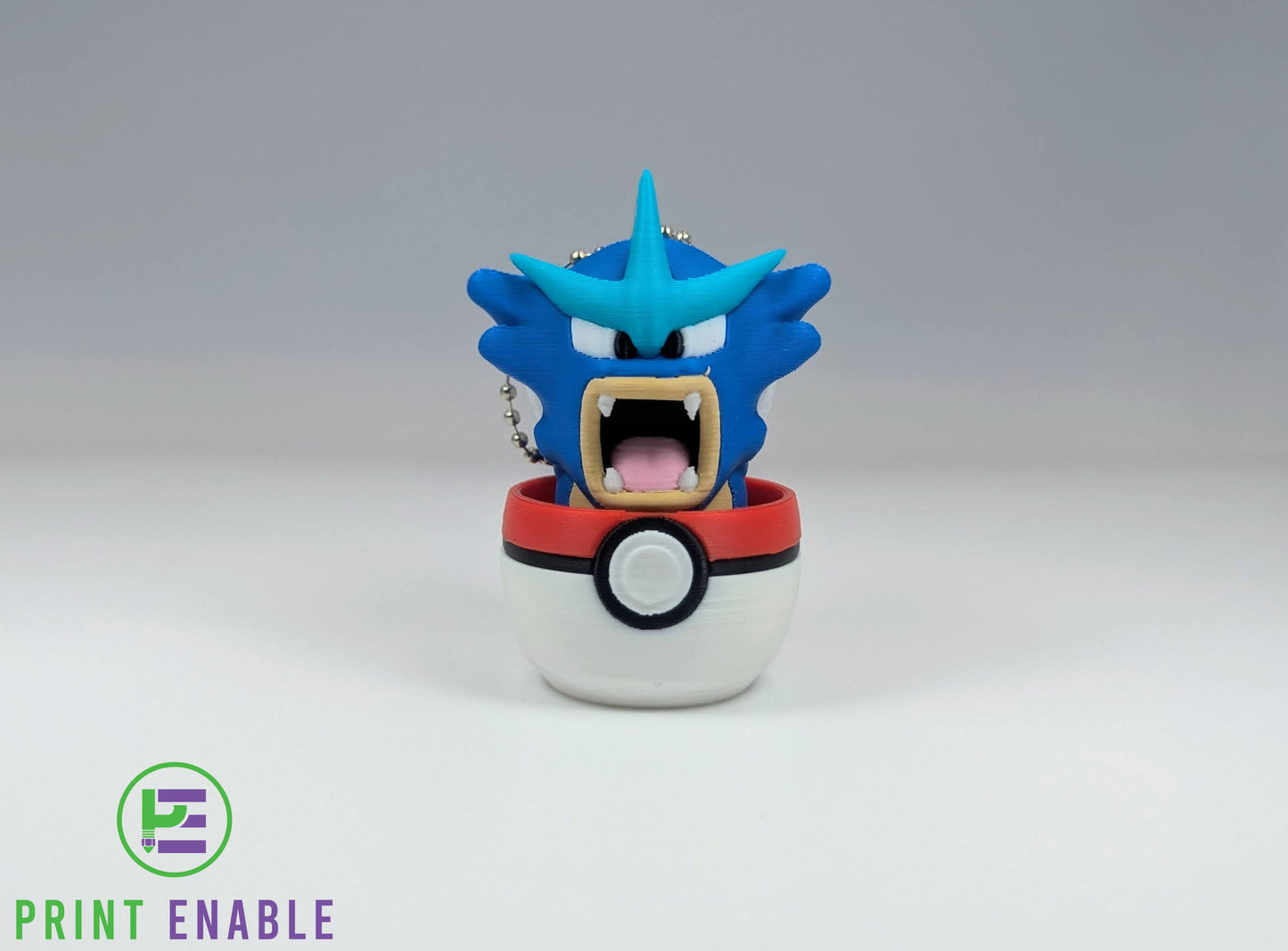 Gyarados 3D printed character fidget clicker keychain emerging from a ball with a satisfying mechanical click action.
