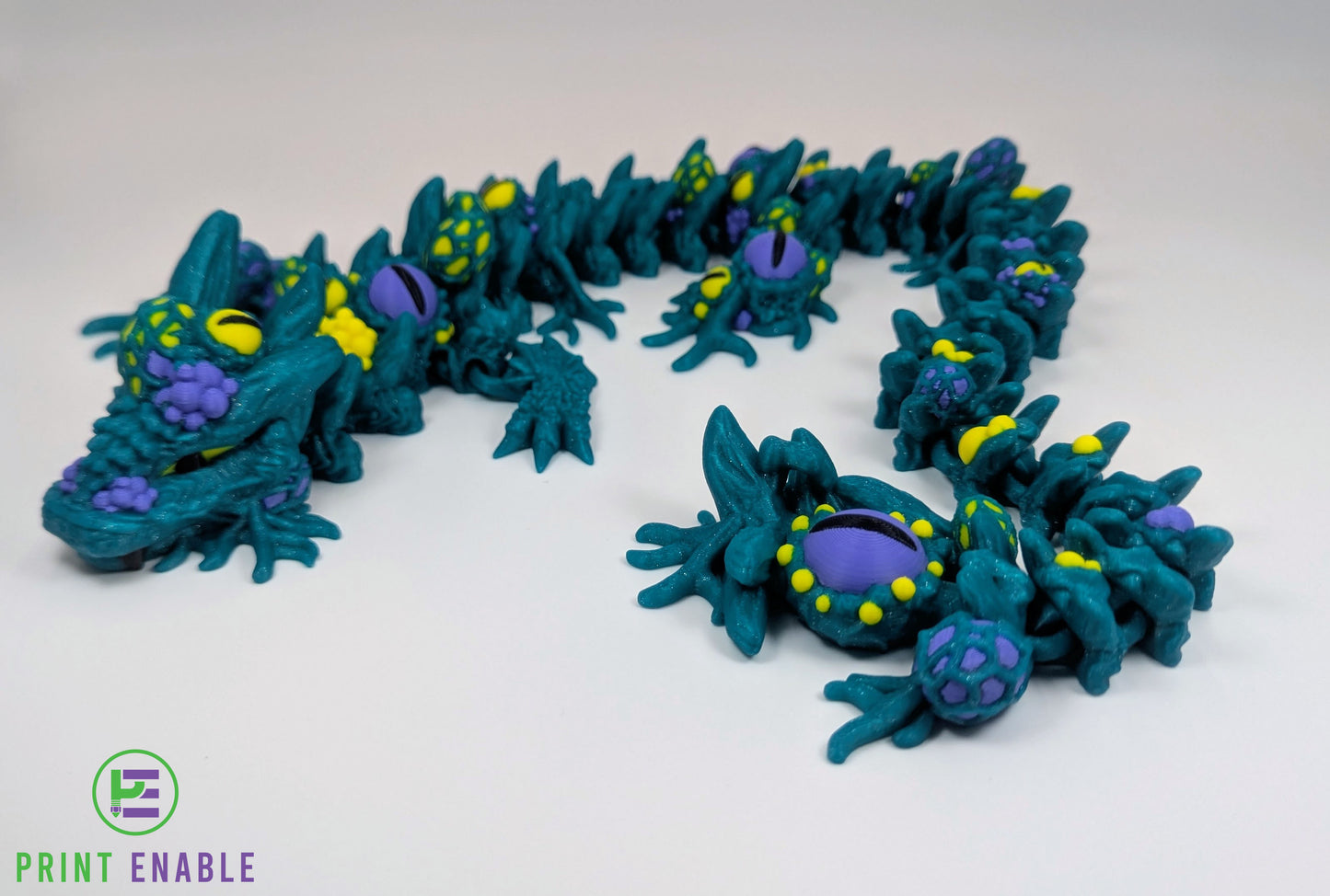 Articulated Infested Dragon featuring multiple eyes and organic creature-inspired details.