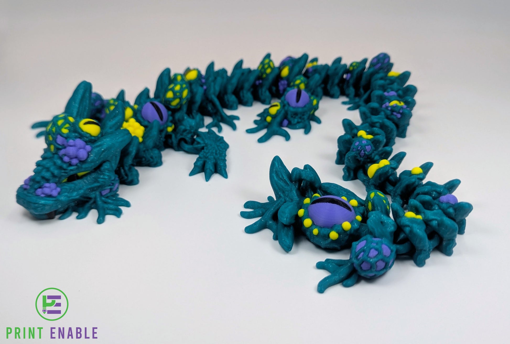 Articulated Infested Dragon featuring multiple eyes and organic creature-inspired details.