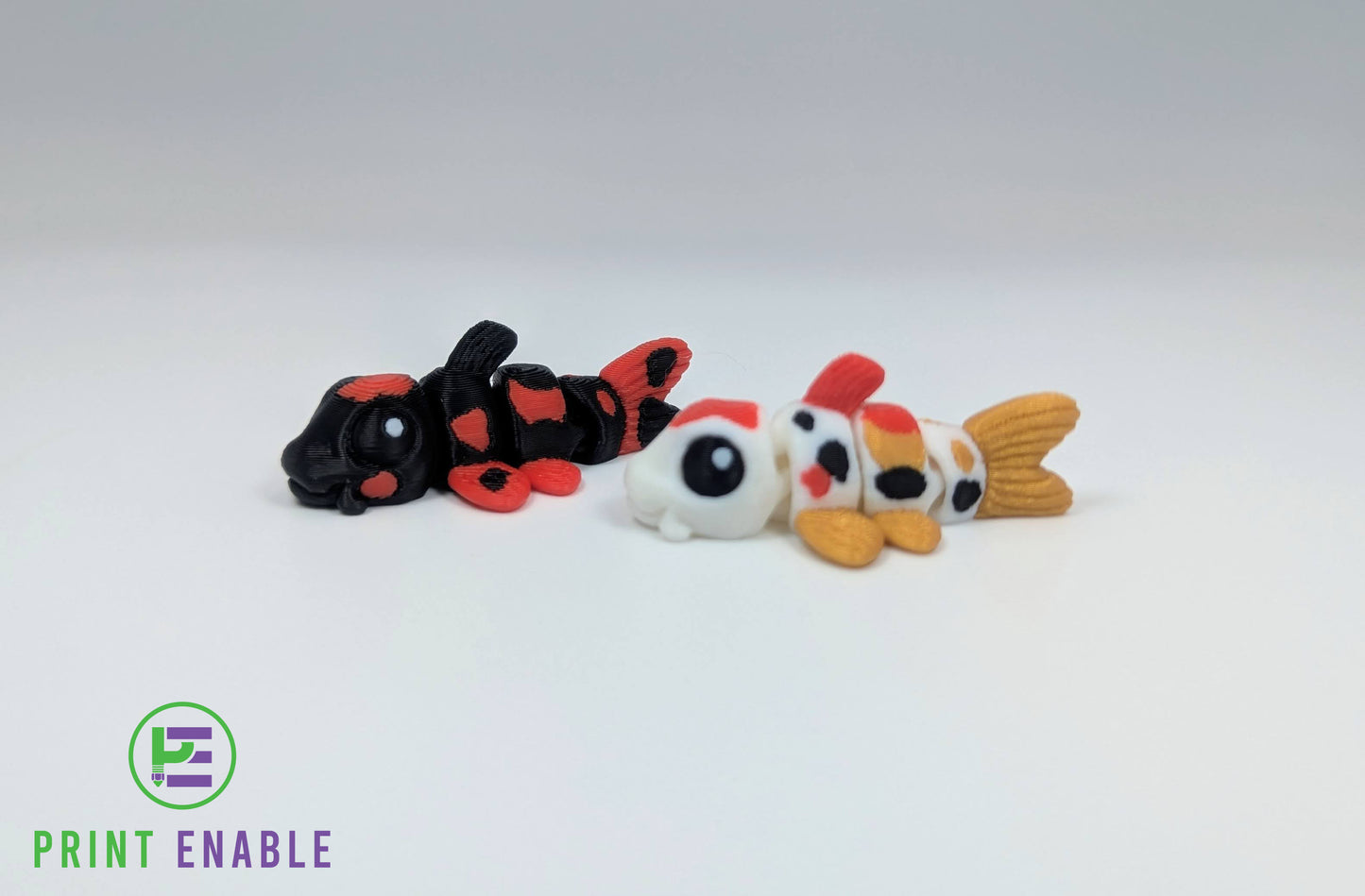Articulated Koi Fish Hatchling and black Koi Fish Hatchling 3D printed fidgets
