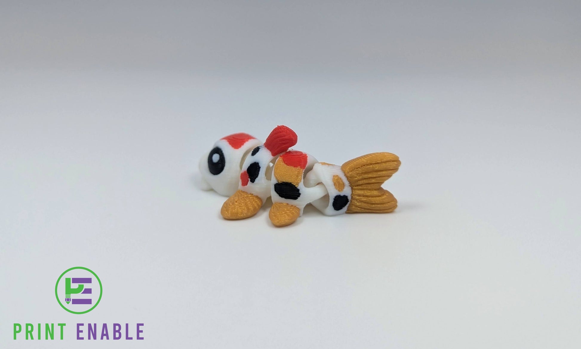 Koi Fish Hatchling articulated 3D printed fidget with decorative fins and tail