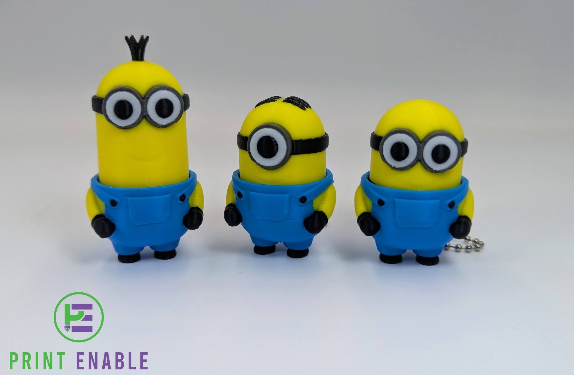 Randomly selected Minions 3D printed fidget clicker keychain featuring a compact character design with a satisfying mechanical click action.