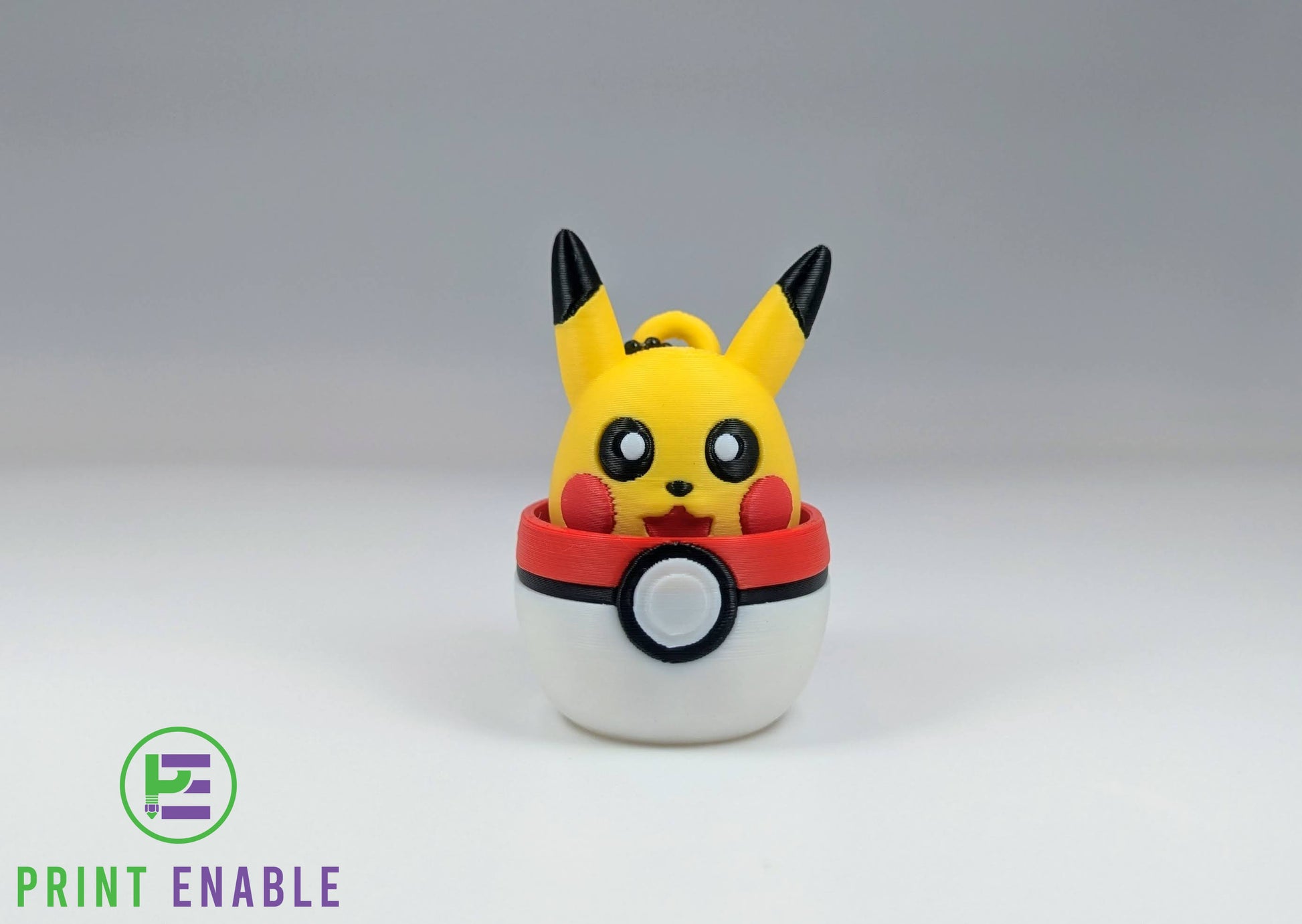Pikachu 3D printed character fidget clicker keychain emerging from a ball with a satisfying mechanical click action.