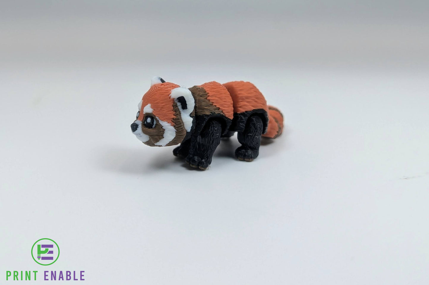 Red Panda Hatchling articulated 3D printed fidget side view showing fluffy tail and body detail