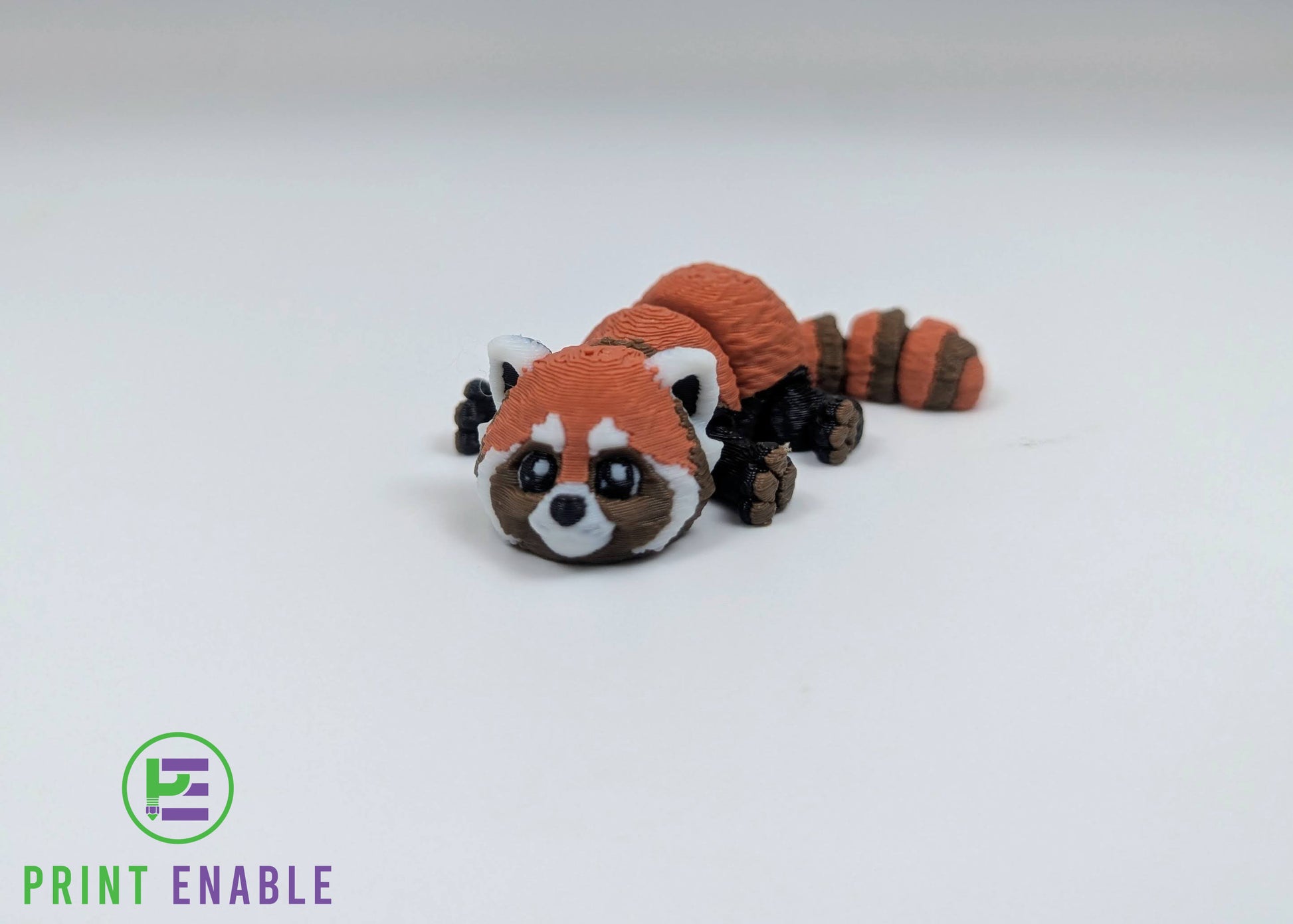 Red Panda Hatchling 3D printed articulated fidget front view with rounded ears and face detail