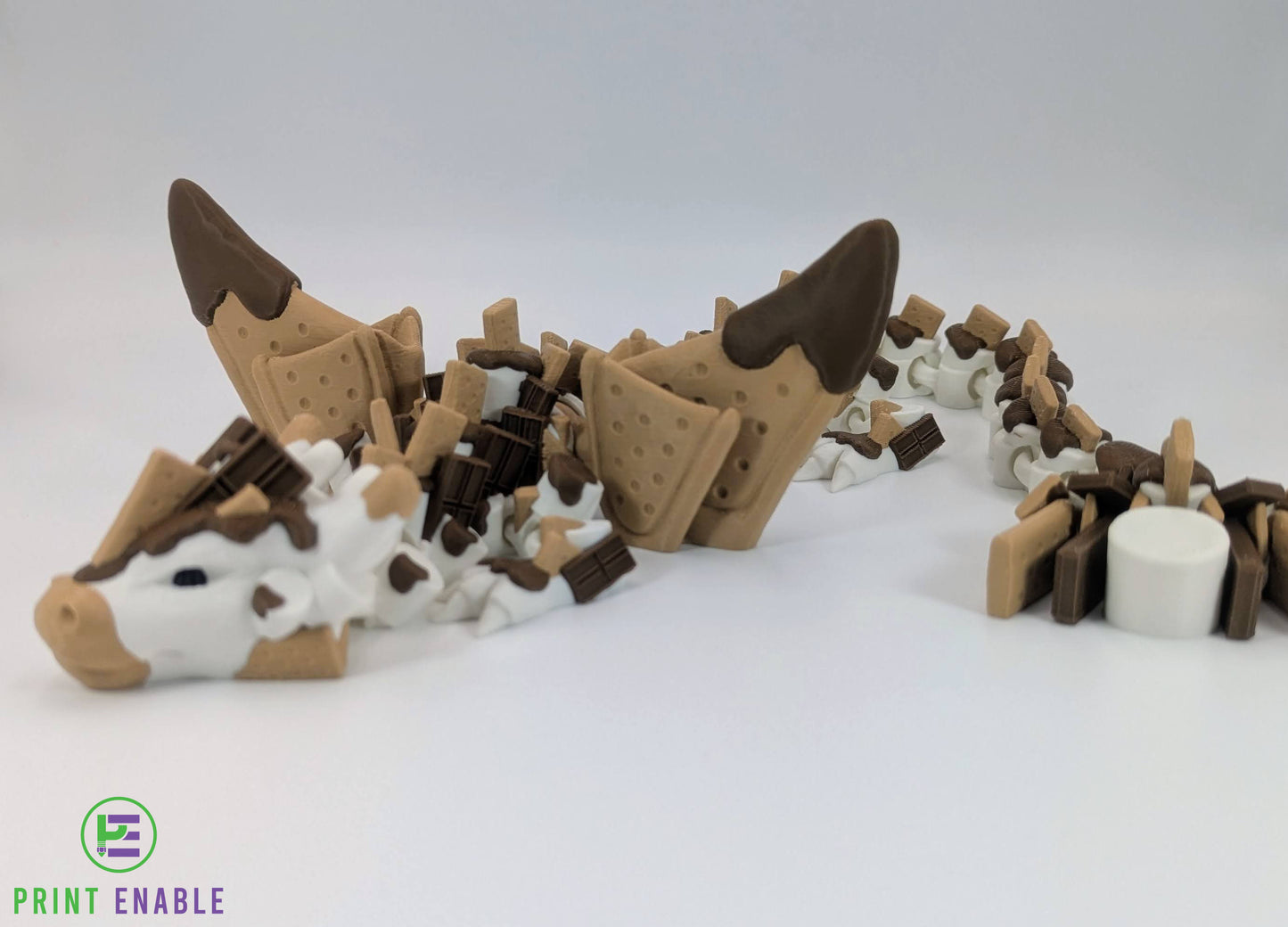Close-up of S'mores Dragon head with chocolate and marshmallow themed detailing