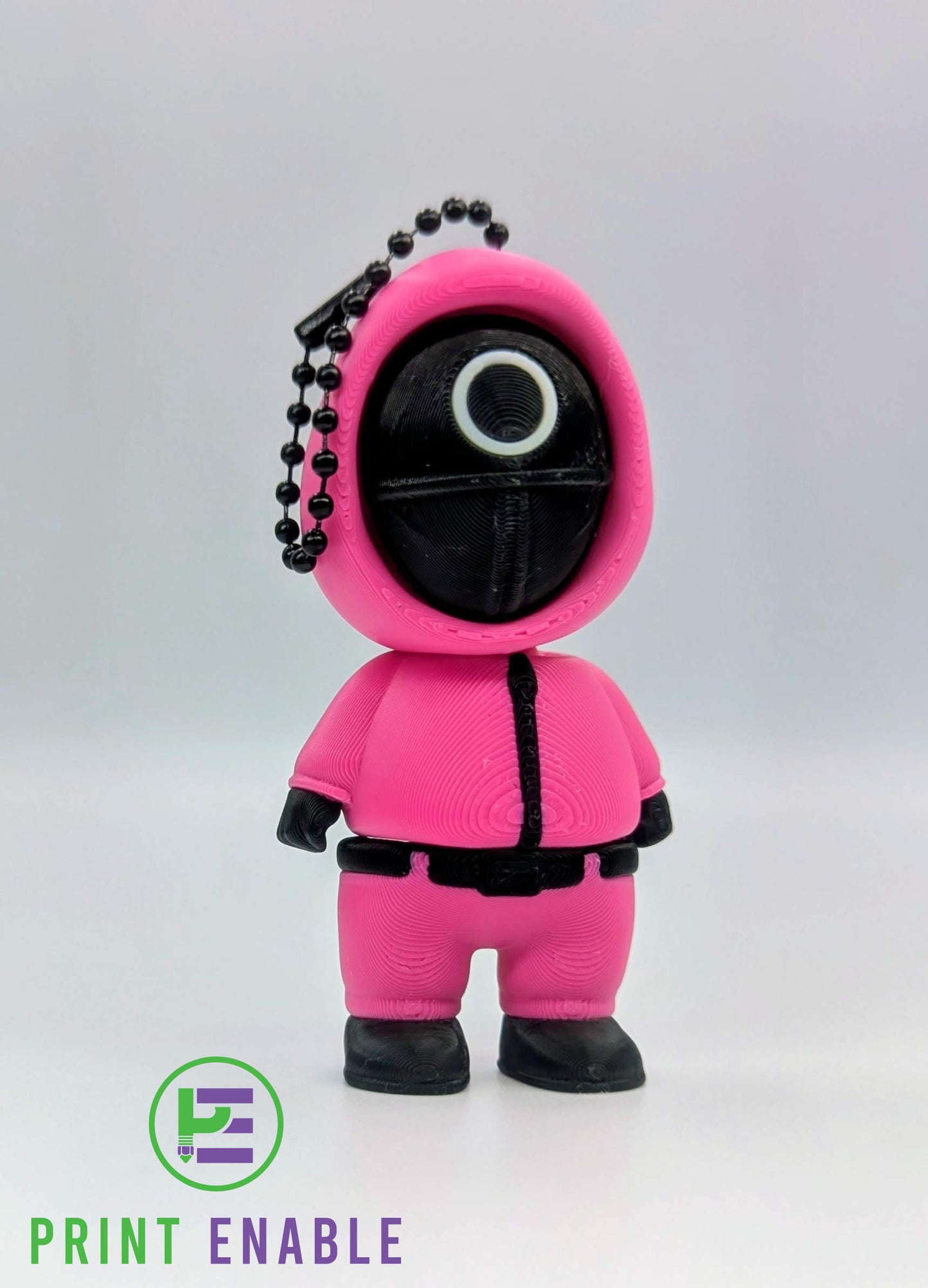 Squid Games-inspired circle guard clicker keychain
