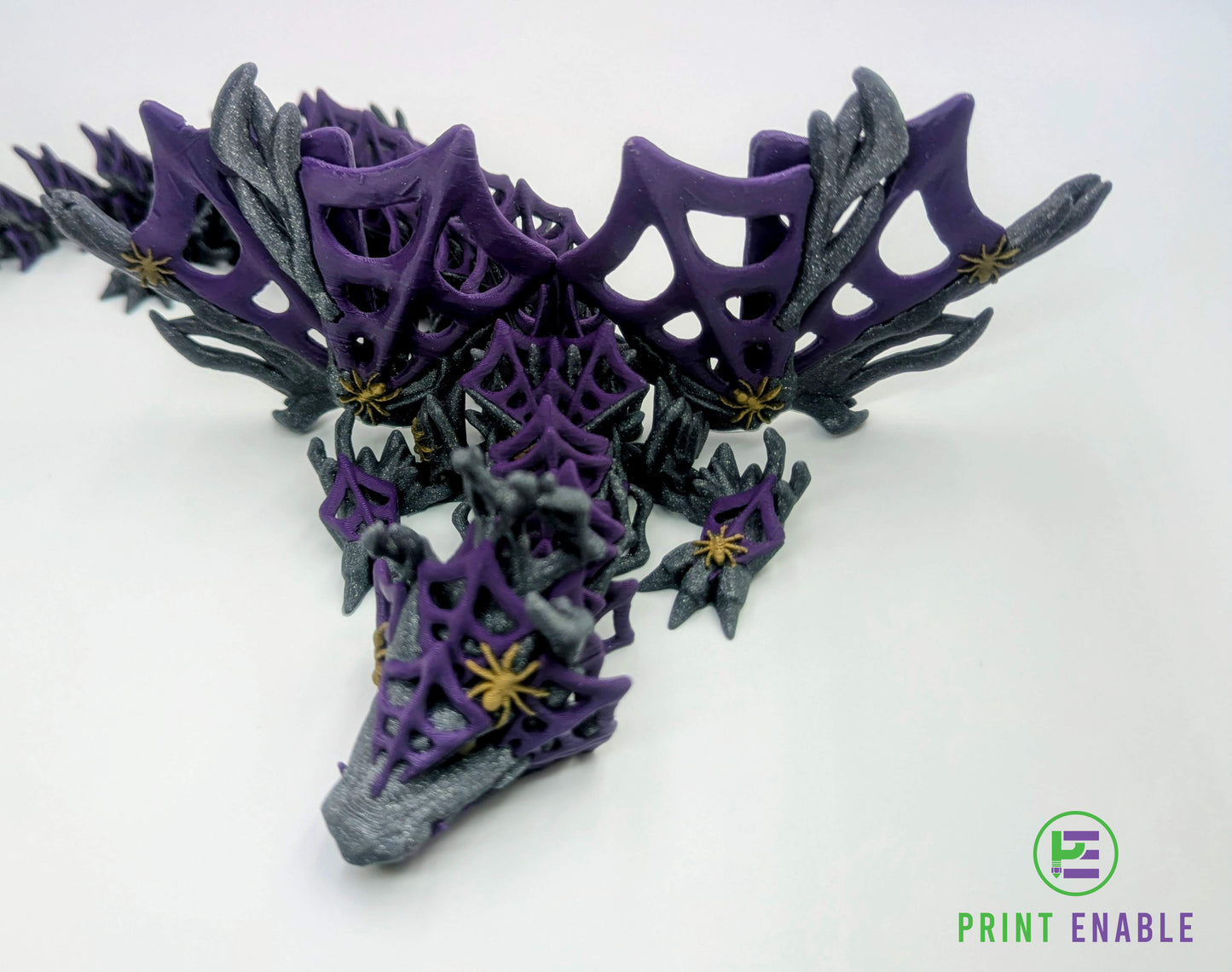 Close-up of a purple and silver Wickedwing Dragon highlighting web textures and spider accents.
