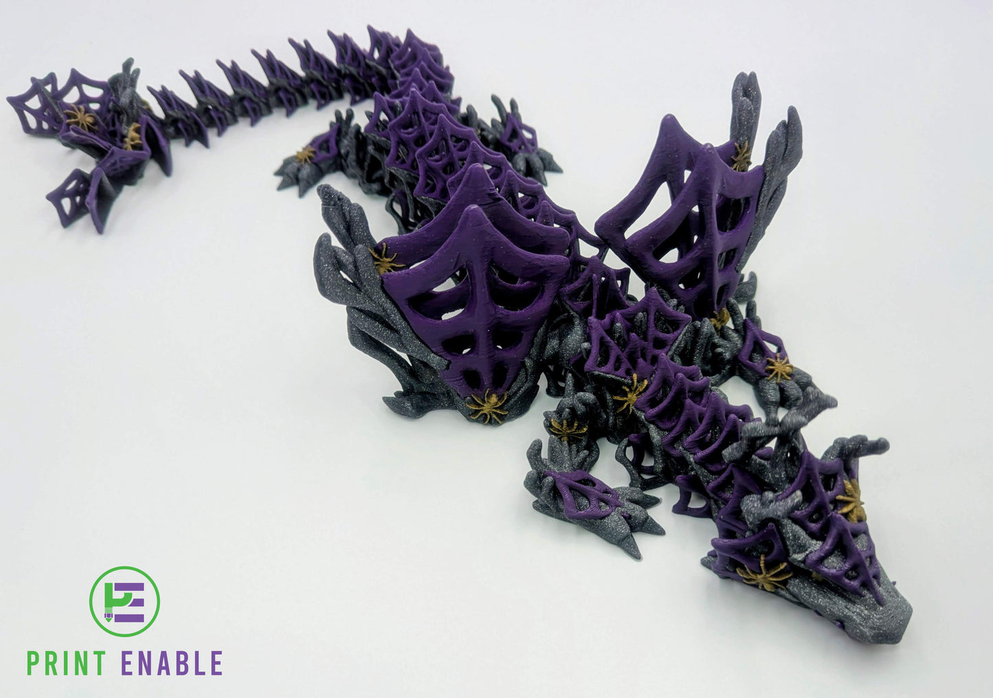 Purple and silver Wickedwing Dragon with articulated body, web wings and decorative spider details.