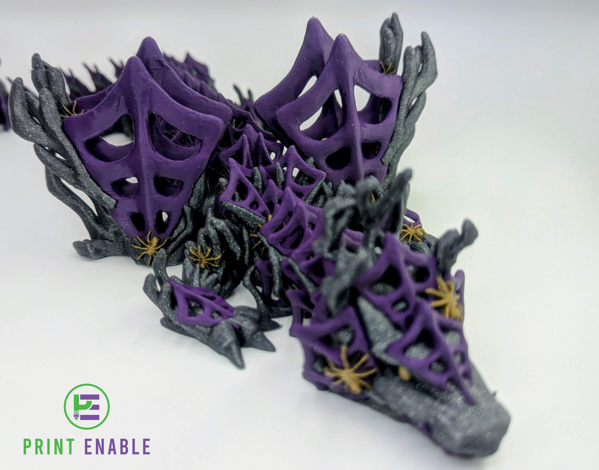 Top view of an articulated Wickedwing Dragon displaying web-patterned wings and segmented body.