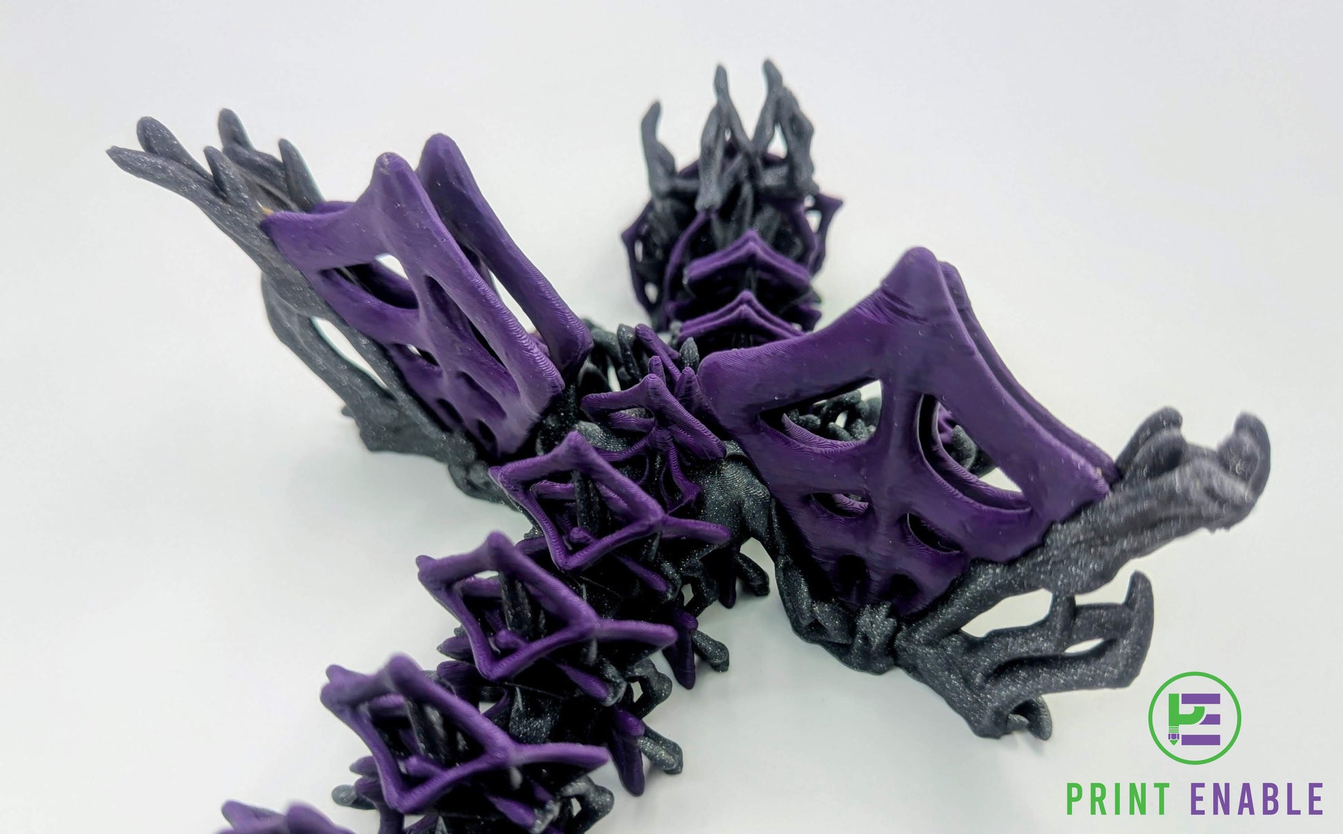Detailed wing section of a purple and silver Wickedwing Dragon showing intricate web-inspired structure.